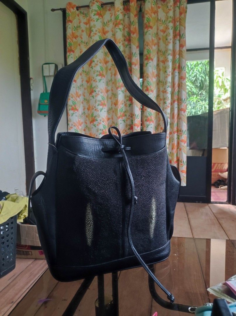 Black Stingray Leather shoulder bag (Category: Luxury Bags & Wallets) located in Zamboanga. Submitted by Clairey03 (Listing ID 1423586532, Image 1). Description: Black leather handbag with a unique stingray leather panel. Features a drawstring closure and shoulder straps. Includes side pockets for extra storage. A stylish and functional accessory for everyday use..