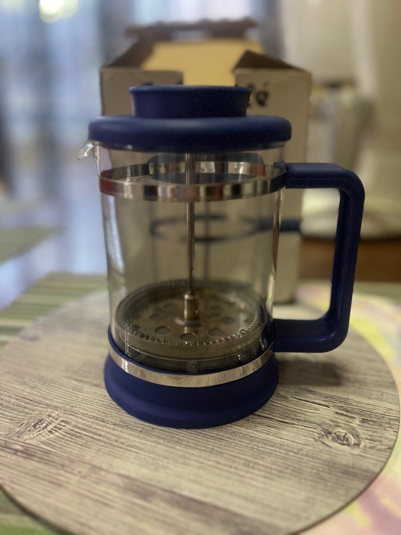Cafe Ole French Press Coffee & Tea Maker (Category: Coffee Machines & Makers) located in San Pedro. Submitted by mighty_oh (Listing ID 1423541542, Image 2). Description: Brew your own coffee or tea with this Cafe Ole French Press. It features a blue lid and handle, with a glass beaker and stainless steel plunger. The box includes instructions for use. Made in Taiwan. Perfect for making coffee or tea at home..