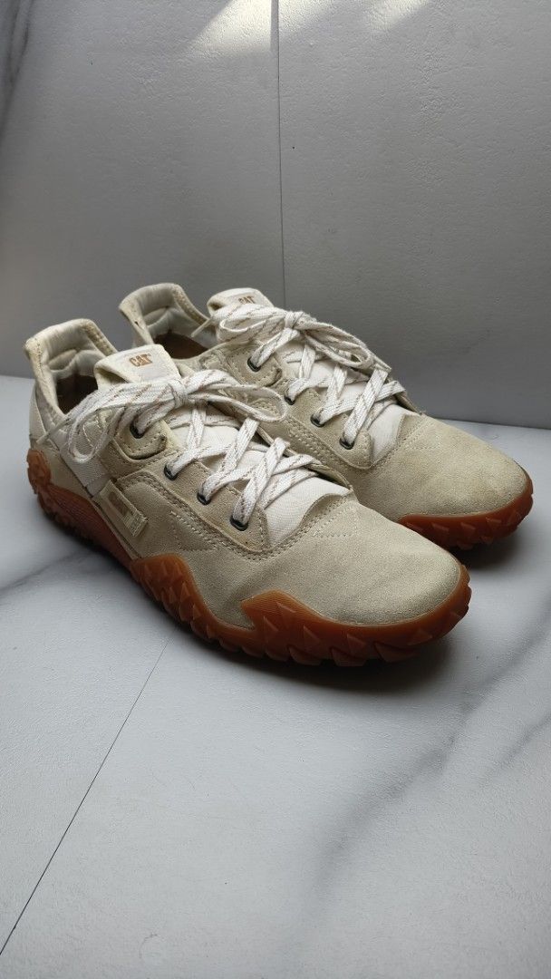 Caterpillar Sneakers - Beige (Category: Sneakers) located in Dasmarinas. Submitted by ziapatos (Listing ID 1423503753, Image 2). Description: Caterpillar sneakers Features a suede upper with a contrasting brown sole. The shoes have a lace-up closure and the Caterpillar logo is visible on the tongue and sole. Size is 8 UK, 9 US Men, 11 US Women, 42 EURO, and 27 CM. Made in Cambodia. -NO BOX - NO COP / NO COD -VERY GOOD CONDITION 🔥🔥 -Php 1,550 On