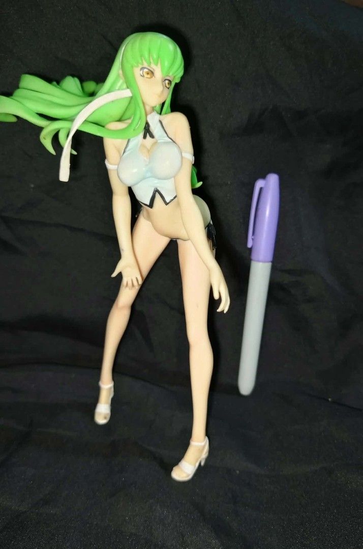 C.C. Code Geass Figure swimsuit ver (Category: Figurines & Statues) located in Kawit. Submitted by monshop714 (Listing ID 1423560238, Image 2). Description: Figure features C.C. from Code Geass. It has green hair and is wearing a white and black outfit. The figure is posed in a standing position. It is a collectible item for fans of the anime series. 22 cm no stand replica 8.6 inches.