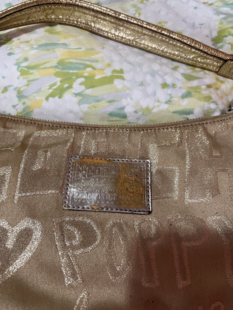 Coach Handbag and Wallet Set (Category: Luxury Bags & Wallets) located in Manila. Submitted by tjsells.101 (Listing ID 1423470042, Image 3). Description: - Authentic Coach set (handbag and wallet). - Gold-toned exterior with signature Coach pattern. - Handbag: - Top handle - Front flap pocket - Purple fabric lining - Wallet: - Multiple card slots - Snap closure - Both items feature the Coach logo..