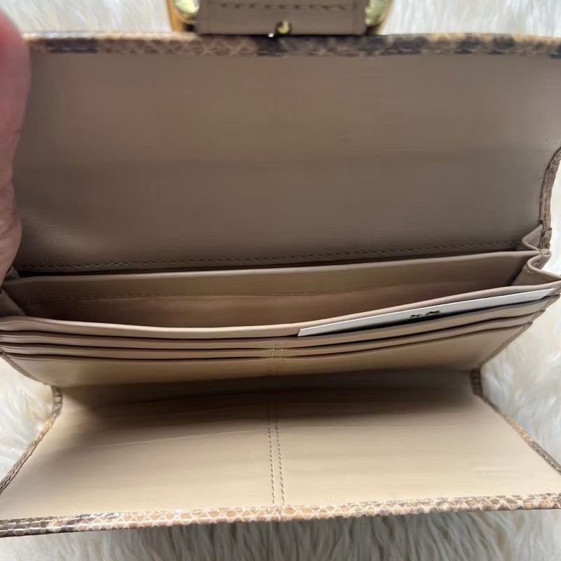 Coach Soho Phyton Embossed Wallet (Category: Luxury Bags & Wallets) located in Pasig City. Submitted by mdv.08 (Listing ID 1423473734, Image 2). Description: 💯Authentic Never been used, still has tags & care card. Selling low MSRP $238.
