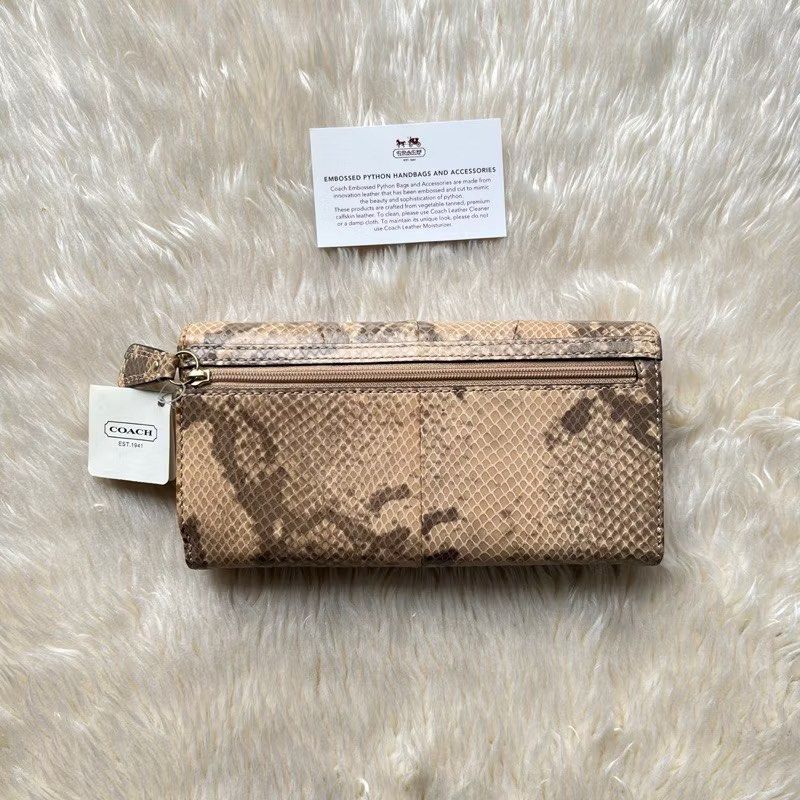 Coach Soho Phyton Embossed Wallet (Category: Luxury Bags & Wallets) located in Pasig City. Submitted by mdv.08 (Listing ID 1423473734, Image 3). Description: 💯Authentic Never been used, still has tags & care card. Selling low MSRP $238.