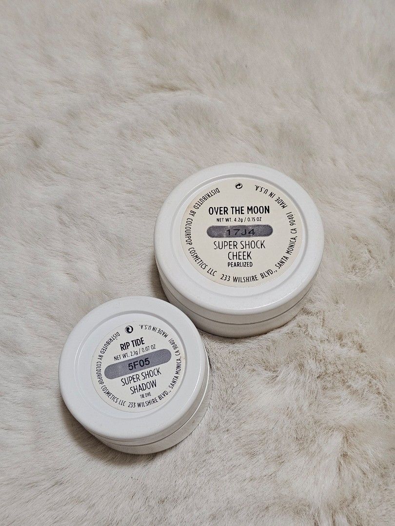 Colourpop Super Shock Cheek & Shadow (Category: Makeup) located in Manila. Submitted by heartallthingspretty (Listing ID 1423565251, Image 2). Description: Colourpop Highlighter bundle ✨️ Rip Tide 2.1grams Over The Moon 4.2grams Set of Colourpop Super Shock eyeshadows and cheek products. Includes "Over The Moon" cheek product and "Rip Tide" eyeshadow. The products are in white compacts with clear lids. The eyeshadows have a shimmery finish. The p
