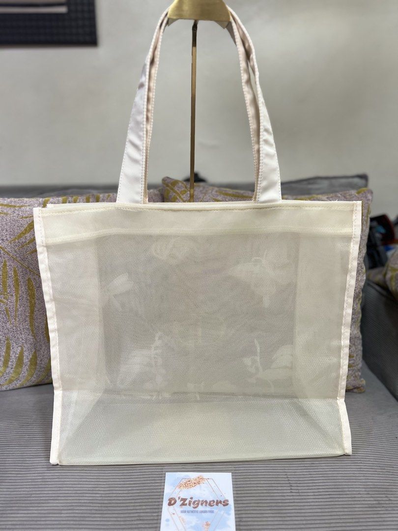 Dior Embroidered Tote Bag gift with purchase (Category: Luxury Bags & Wallets) located in Quezon City. Submitted by DZignersbyZsa (Listing ID 1423574714, Image 2). Description: - Authentic Dior tote bag gift with purchase - Delicate floral and butterfly embroidery - Sheer, cream-colored exterior - Luxurious satin handles - Gold-colored CD logo - Spacious design - Perfect for carrying essentials Brandnew sealed inside the plastic original packagin