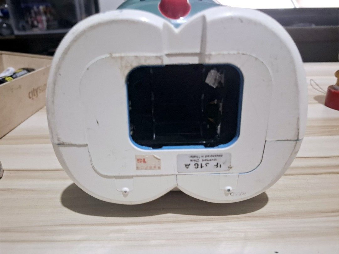 Doraemon Alarm Clock (Category: Clocks) located in Antipolo. Submitted by lakay_toys (Listing ID 1423578570, Image 3). Description: - Doraemon alarm clock - Classic design - Yellow clock face - Red nose and collar - Speaker and battery compartment at the back - Sticker at the bottom.