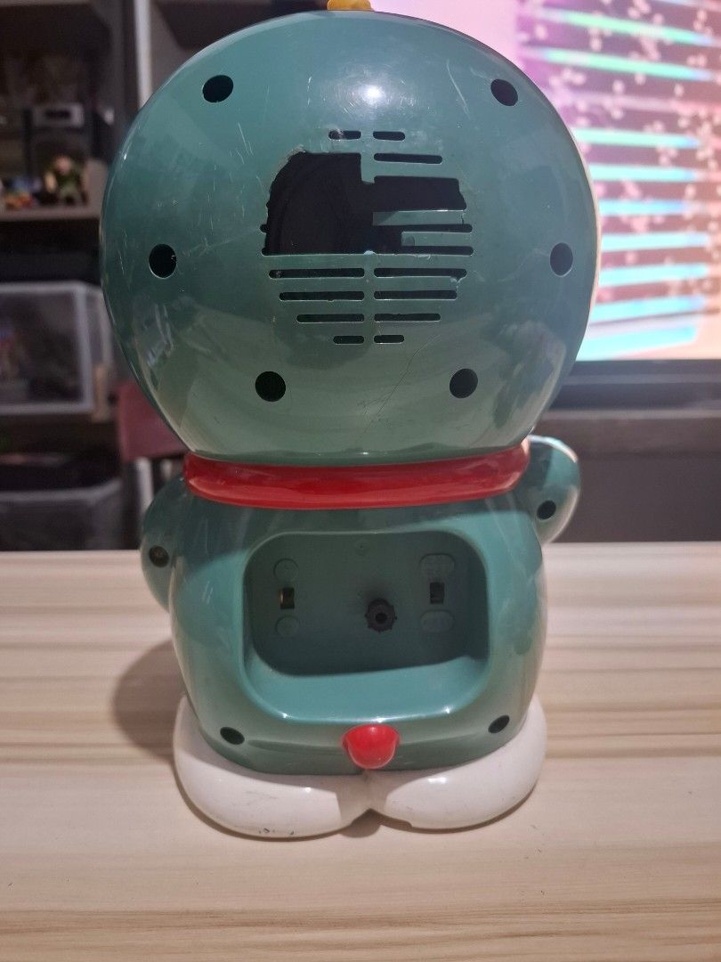 Doraemon Alarm Clock (Category: Clocks) located in Antipolo. Submitted by lakay_toys (Listing ID 1423578570, Image 2). Description: - Doraemon alarm clock - Classic design - Yellow clock face - Red nose and collar - Speaker and battery compartment at the back - Sticker at the bottom.