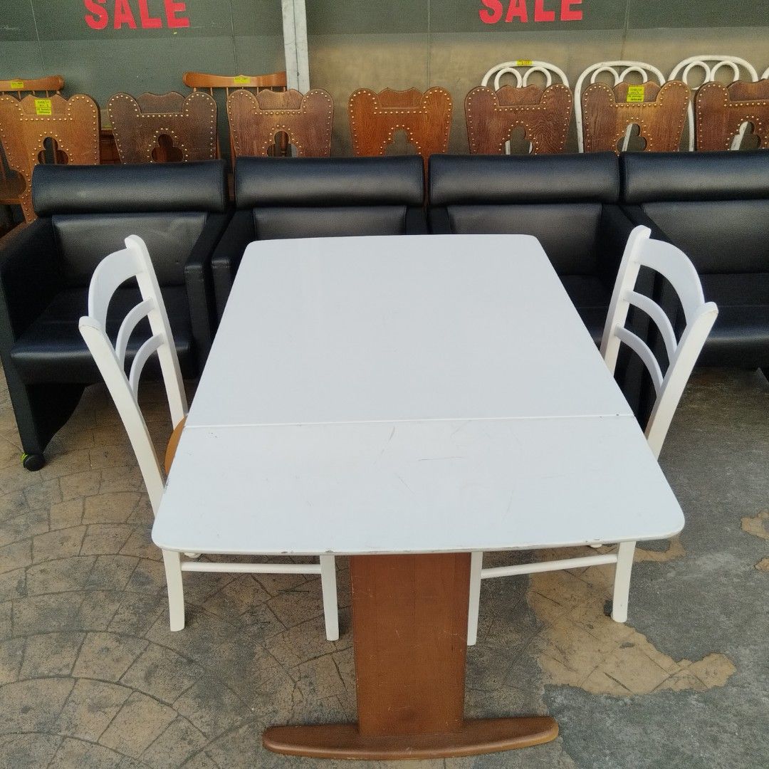 Extendable Dining Table with 2 Chairs (Category: Tables & Sets) located in Paranaque City. Submitted by eu.kr.jpsurplus (Listing ID 1423556458, Image 1). Description: Dining set includes an extendable white table and two chairs. The table has a brown wooden base. The chairs have white frames and tan seats. The table is extendable, offering flexibility for different dining needs. Perfect for small spaces or gatherings..