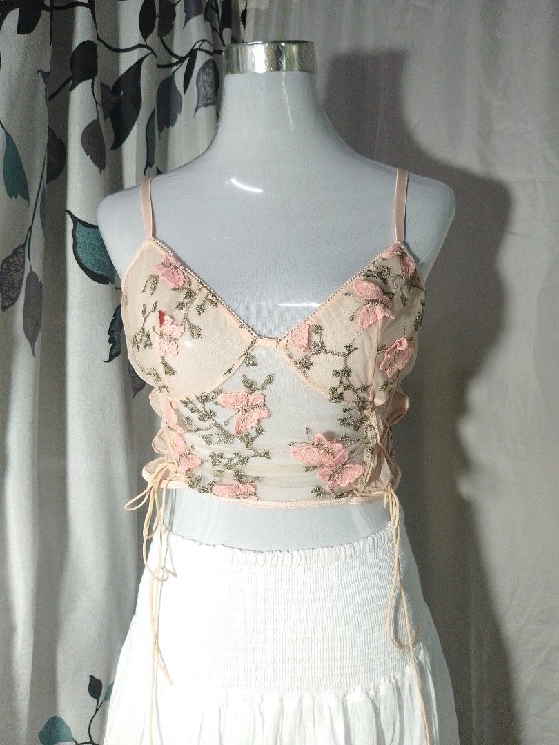 Floral Embroidered Crop Top (Category: Others Tops) located in Bacoor. Submitted by declutter_grly (Listing ID 1423438141, Image 1). Description: - Floral embroidered crop top - Adjustable straps - Drawstring sides - Sheer, light fabric - Pink floral accents - Perfect for summer or layering Bacoor, Cavite.