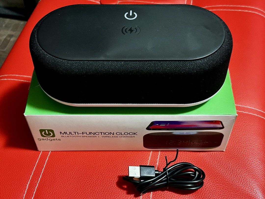 Gadgets Multi-Function Clock with Wireless Charger (Category: Clocks) located in Las Pinas. Submitted by rjmwings (Listing ID 1423535170, Image 1). Description: Multi-function clock from Gadgets Features a Bluetooth speaker and wireless charging capabilities. It also includes an alarm clock, temperature display, and 10 LED mood lights. The unit comes with a USB cable and a user manual. The box indicates a model number of NG-CWC2..