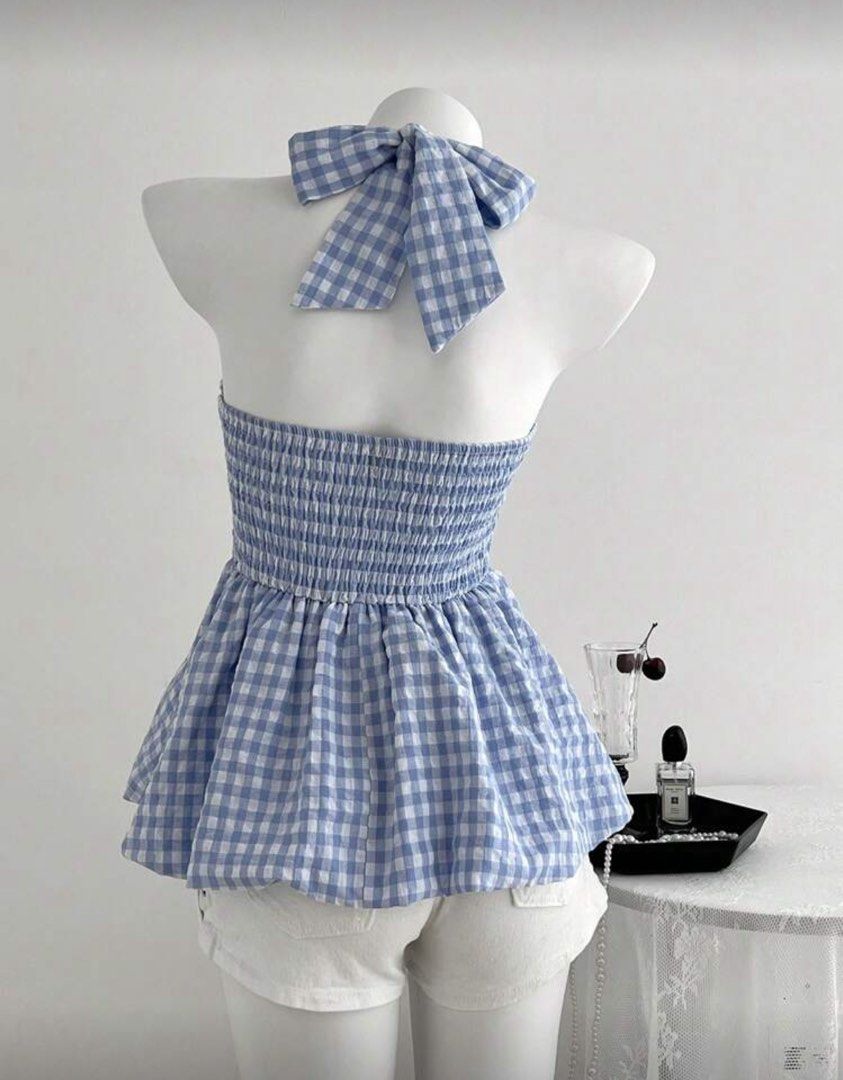 Gingham Halter Top (Category: Sleeveless) located in Dasmarinas. Submitted by _beautifulthings_ (Listing ID 1423451739, Image 2). Description: - Blue and white gingham pattern - Halter neck design - Bow detail at the back - Fitted bodice - Flared peplum hem - Perfect for a casual and chic look.