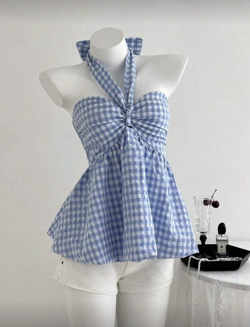 Gingham Halter Top (Category: Sleeveless) located in Dasmarinas. Submitted by _beautifulthings_ (Listing ID 1423451739, Image 1). Description: - Blue and white gingham pattern - Halter neck design - Bow detail at the back - Fitted bodice - Flared peplum hem - Perfect for a casual and chic look.
