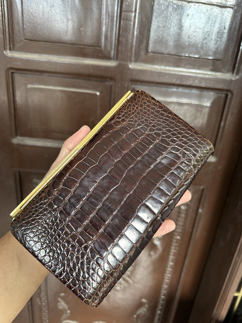 Gucci alligator evening Clutch (Category: Luxury Bags & Wallets) located in Bustos. Submitted by theprelovedshopbulacan (Listing ID 1423438428, Image 3). Description: - Vintage Gucci clutch bag - Brown crocodile leather - Gold-tone GG logo clasp - Rectangular shape - Structured design - Similar bag retails for $1,525.