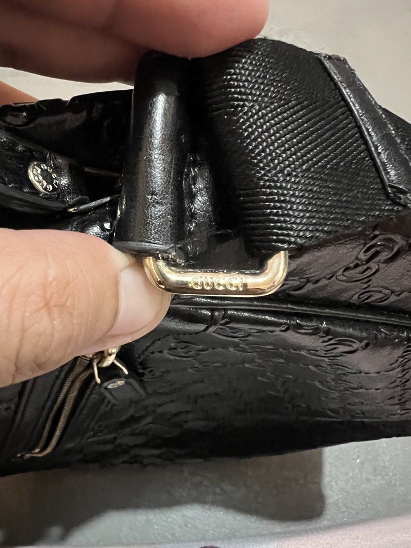 Gucci Guccissima Leather Shoulder Bag (Category: Luxury Bags & Wallets) located in Badian. Submitted by choloknows (Listing ID 1423439141, Image 2). Description: - Black leather with Guccissima pattern - Zipper closure - Adjustable shoulder strap - Gucci logo on zipper, strap hardware, and interior - Made in Italy - Model number: 20141S 1208R - minor issue: see last 2 picture.