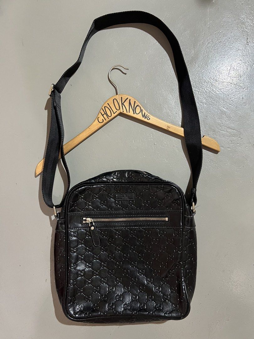 Gucci Guccissima Leather Shoulder Bag (Category: Luxury Bags & Wallets) located in Badian. Submitted by choloknows (Listing ID 1423439141, Image 1). Description: - Black leather with Guccissima pattern - Zipper closure - Adjustable shoulder strap - Gucci logo on zipper, strap hardware, and interior - Made in Italy - Model number: 20141S 1208R - minor issue: see last 2 picture.