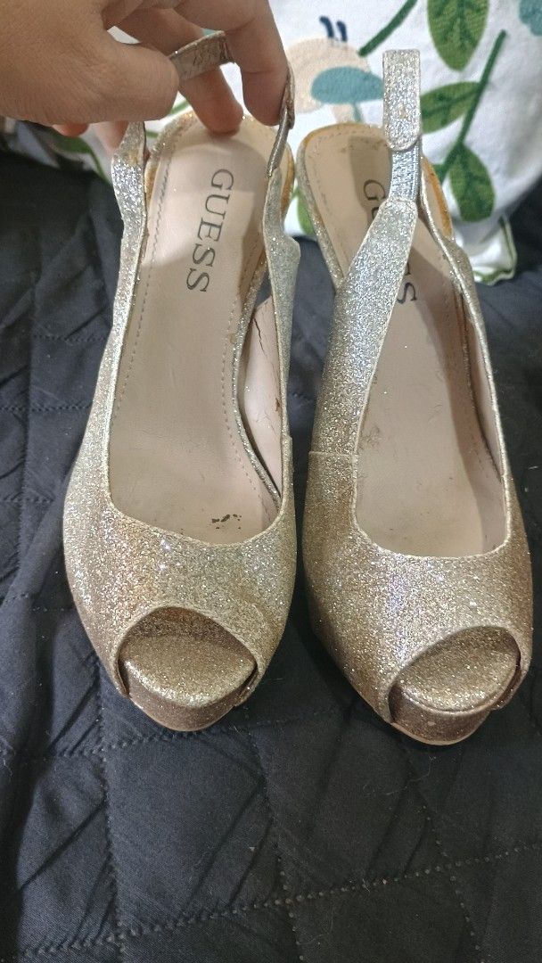 Guess Glitter Slingback Heels (Category: Heels) located in Plaridel. Submitted by QualityShop (Listing ID 1423480417, Image 1). Description: - Guess slingback heels - Glittery finish - Open-toe design - Slender heel - Secure strap - Guess logo on insole - Perfect for special occasions.