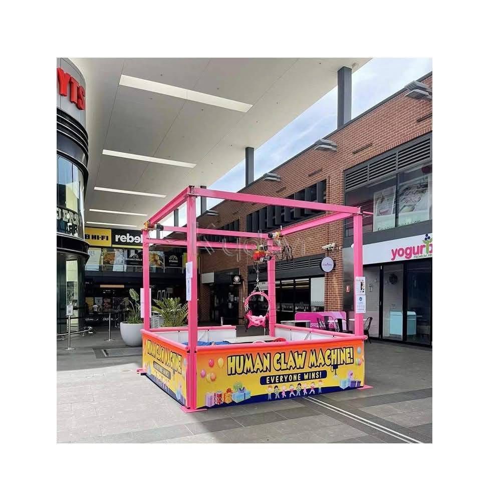 Human Claw Machine (Category: Kids Toys) located in San Pablo. Submitted by vennisa.sportssupplies (Listing ID 1423503819, Image 1). Description: - Rent our giant human claw machine! - Ideal for parties and events. - Eye-catching pink design. - Large play area for maximum fun. - Features the slogan 'Everyone Wins!' - Guaranteed entertainment for all ages..