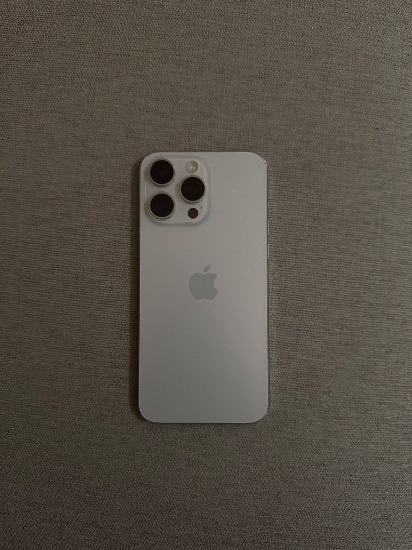 Iphone 15 pro max (Category: iPhone 15 Series) located in Pasig City. Submitted by nicll (Listing ID 1423517674, Image 1). Description: Iphone 15 pro max 256gb White Titanium 80% battery health Barely noticeable to no scratches at all Used with care Rfs: Upgraded .