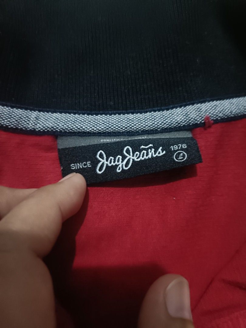 Jag Jeans Red Polo Shirt (Category: Blouses) located in Marikina City. Submitted by elleselections (Listing ID 1423513682, Image 2). Description: Size: med-large Good as new - Jag Jeans red polo shirt - Size 4 - Black collar and sleeve cuffs with white accents - Button-up placket - Small logo on chest.