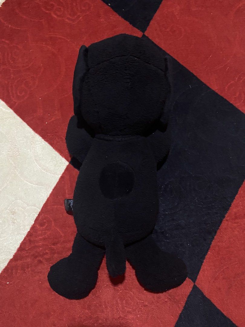 KAWS x Peanuts Snoopy Plush Toy (Category: Plushies & Soft Toys) located in Opol. Submitted by yashaofficial (Listing ID 1423476578, Image 3). Description: - KAWS x Peanuts Snoopy plush toy - Color: Black - Design: KAWS "XX" on one eye - Collaboration: Uniqlo - Pose: Snoopy lying down - Material: 100% Polyester.