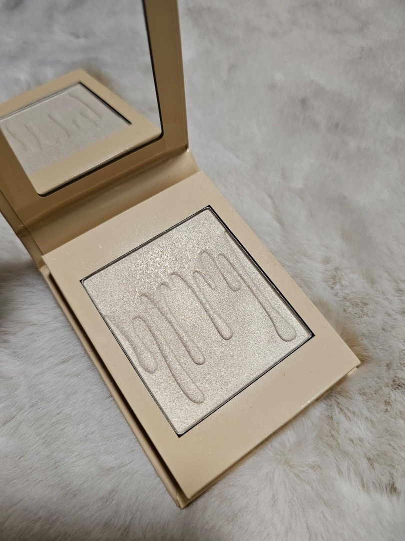 Kylie Cosmetics Highlighter (Category: Makeup) located in Manila. Submitted by heartallthingspretty (Listing ID 1423552725, Image 1). Description: Kylie Pressed Illuminating Highlighter French Vanilla 9.50grams swatched Kylie Cosmetics highlighter. The product is in a square compact with a mirror. The highlighter itself is a light, shimmery shade. The compact is a light beige color with the brand name printed on the front..
