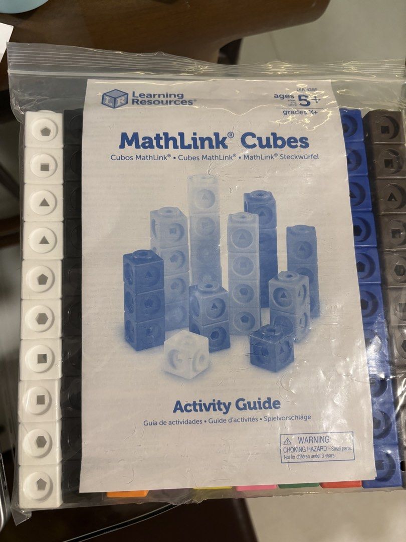 Learning Resources MathLink Cubes (Category: Educational & Learning Toys) located in Singapore. Submitted by candycanecookie (Listing ID 1423556611, Image 2). Description: - Includes colorful cubes. - Comes with an activity guide. - Perfect for educational math activities. .