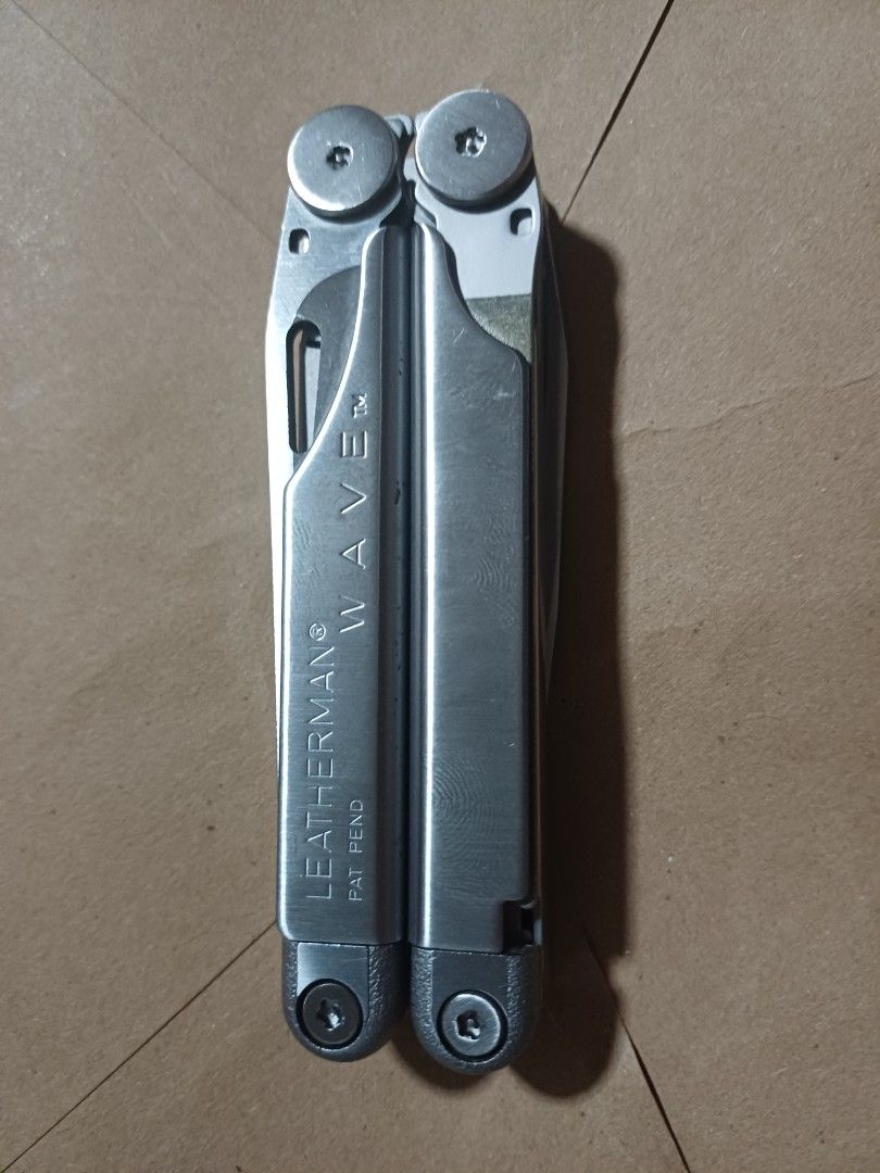 Leatherman Wave Multi-tool with Case (Category: Hiking & Camping) located in Manila. Submitted by cly08 (Listing ID 1423612849, Image 2). Description: - Original 1998 1st Gen. Leatherman Wave multi-tool - Comes with a brown leather case. - Functions include pliers, knives, and saws. - Leatherman Wave logo is embossed on the case. - Tool is in good condition..