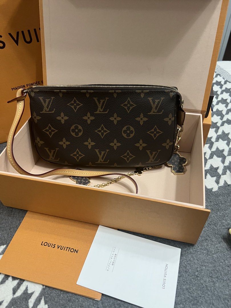 Louis Vuitton Pochette Accessories Monogram (Category: Luxury Bags & Wallets) located in Manila. Submitted by murafinds26 (Listing ID 1423577777, Image 3). Description: - Authentic Louis Vuitton Pochette Accessories - Monogram canvas - Zip closure - Interior pocket - Detachable strap - Includes: Original box, dust bag, paperwork, gold-tone chain, and flower charm.