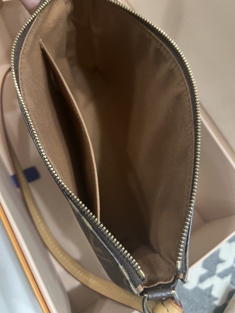 Louis Vuitton Pochette Accessories Monogram (Category: Luxury Bags & Wallets) located in Manila. Submitted by murafinds26 (Listing ID 1423577777, Image 2). Description: - Authentic Louis Vuitton Pochette Accessories - Monogram canvas - Zip closure - Interior pocket - Detachable strap - Includes: Original box, dust bag, paperwork, gold-tone chain, and flower charm.