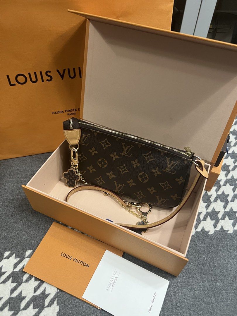 Louis Vuitton Pochette Accessories Monogram (Category: Luxury Bags & Wallets) located in Manila. Submitted by murafinds26 (Listing ID 1423577777, Image 1). Description: - Authentic Louis Vuitton Pochette Accessories - Monogram canvas - Zip closure - Interior pocket - Detachable strap - Includes: Original box, dust bag, paperwork, gold-tone chain, and flower charm.