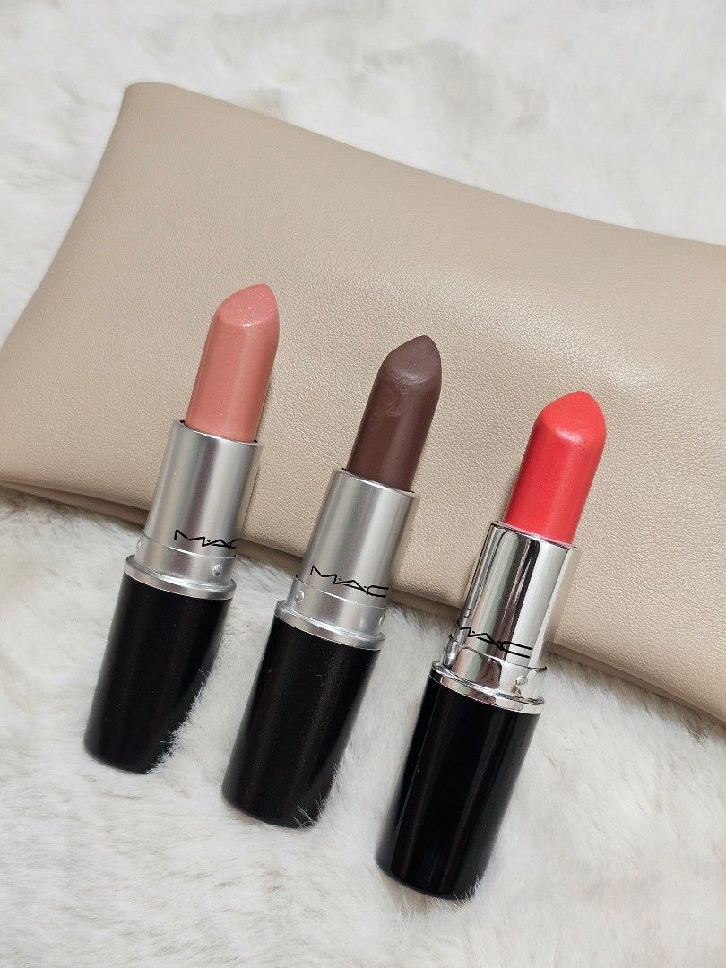 MAC Lipstick (Category: Makeup) located in Manila. Submitted by heartallthingspretty (Listing ID 1423568691, Image 1). Description: M.A.C. 💋 Peach Blossom Stone ✖️ SOLD Kissmet 500php each No box - Set of 3 MAC Lipsticks - Shades: Coral, Brown, and Nude - Classic black tubes with silver accents - Includes a beige pouch.
