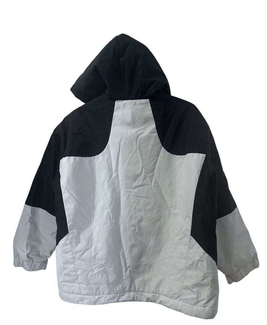 Men MT Color Black Jacket with Hood (Category: Coats, Jackets and Outerwear) located in Manila. Submitted by samzzes (Listing ID 1423436395, Image 2). Description: - Color block design: black and white panels - Features a hood - "MT" logo on front and hood - Full-zip closure - Cuffs with "RASTOBTAIN" print - Suitable for winter.