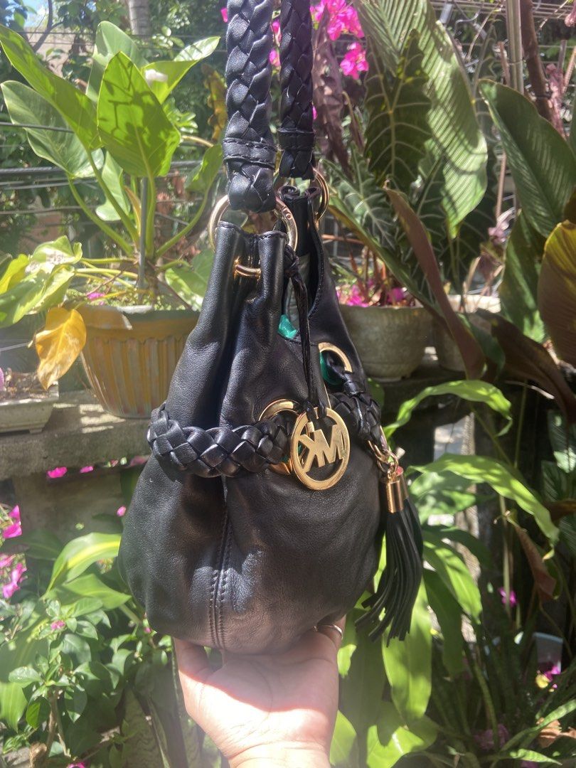 Michael Kors Black Hobo Bag (Category: Luxury Bags & Wallets) located in Rizal. Submitted by rosemarievillaluna176 (Listing ID 1423480972, Image 3). Description: - Black Michael Kors hobo bag - Braided strap detail - Gold-tone hardware - Tassel charm - Drawstring closure - MK logo lining - Interior zippered pocket - Made in China.