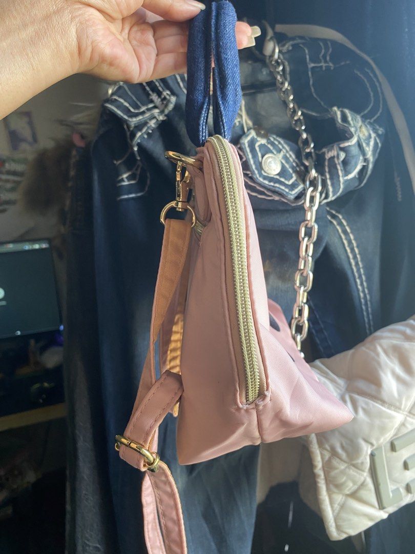 Mis Zapatos Pink Handbag (Category: Tote Bags) located in Mandaue City. Submitted by lizcui28 (Listing ID 1423513275, Image 2). Description: - Pink handbag with a unique design - Denim handles - Shoe-themed graphic - Secure zip closure - Detachable shoulder strap - Interior with multiple compartments - Elegant gold-toned hardware - Brand name detail on zipper.