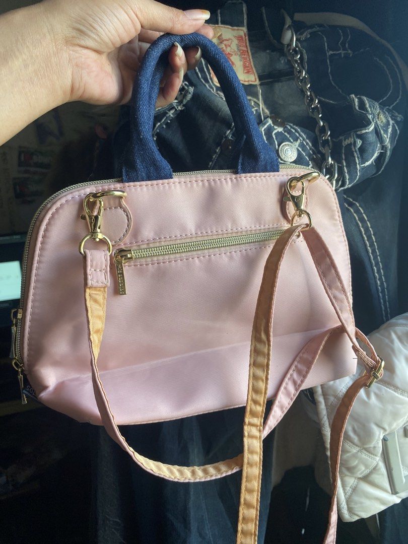Mis Zapatos Pink Handbag (Category: Tote Bags) located in Mandaue City. Submitted by lizcui28 (Listing ID 1423513275, Image 3). Description: - Pink handbag with a unique design - Denim handles - Shoe-themed graphic - Secure zip closure - Detachable shoulder strap - Interior with multiple compartments - Elegant gold-toned hardware - Brand name detail on zipper.