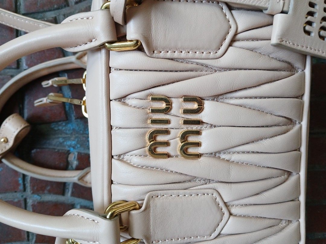 Miu Miu Matelassé Mini Bag (Category: Luxury Bags & Wallets) located in Makati City. Submitted by ruschenmor25535 (Listing ID 1423506952, Image 2). Description: - Miu Miu mini bag - Quilted design - Top handle - Detachable shoulder strap - Gold-tone zipper and hardware - Interior pocket with Miu Miu logo - Made in Italy.