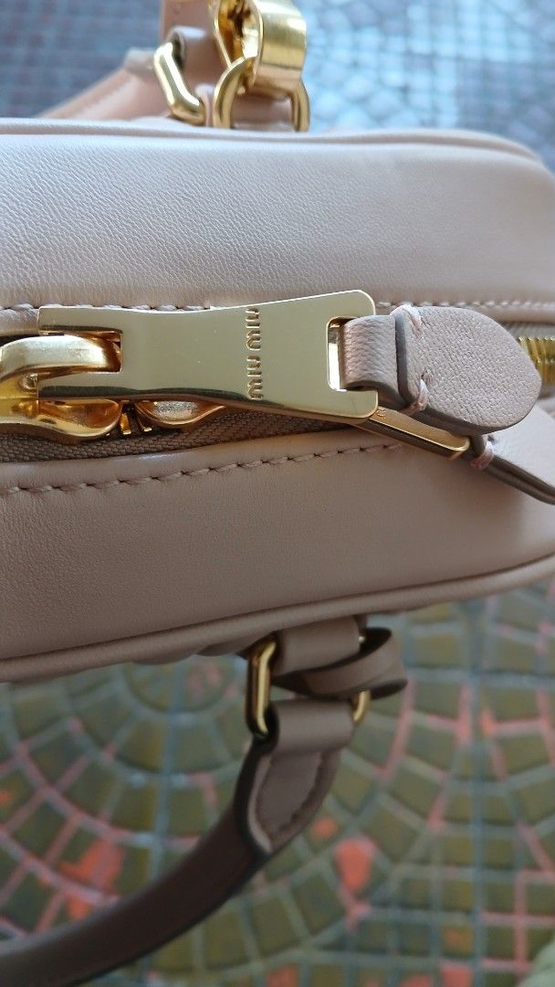 Miu Miu Matelassé Mini Bag (Category: Luxury Bags & Wallets) located in Makati City. Submitted by ruschenmor25535 (Listing ID 1423506952, Image 3). Description: - Miu Miu mini bag - Quilted design - Top handle - Detachable shoulder strap - Gold-tone zipper and hardware - Interior pocket with Miu Miu logo - Made in Italy.