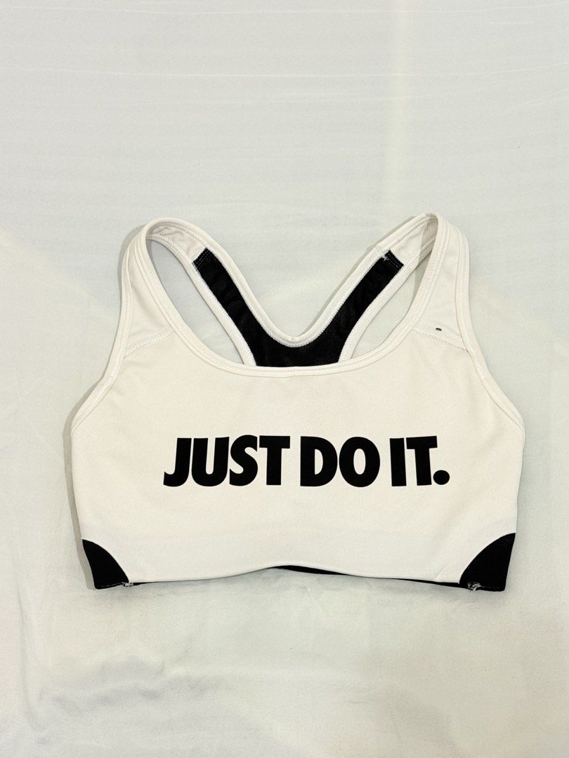 Nike Just Do It Sports Bra (Category: Activewear) located in Makati City. Submitted by reinadigitals (Listing ID 1423528286, Image 1). Description: White and black Nike sports bra with the iconic "Just Do It" slogan. Features a racerback design and the Nike logo on the back. The bra is made with Dri-FIT material. Size is XS. Made in Sri Lanka..