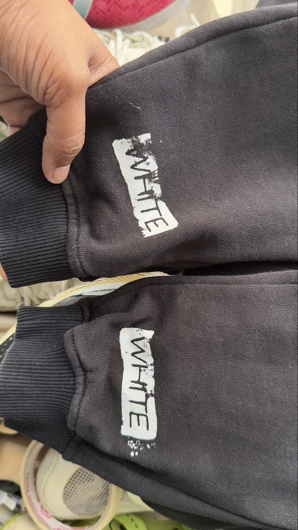 Off-White Black Sweatpants (Category: Joggers) located in Padre Garcia. Submitted by dripden_ph (Listing ID 1423468813, Image 3). Description: - Off-White sweatpants - White stripes on legs - "WHITE" printed on cuffs - Drawstring waist - Soft, comfortable material - Size tag visible - Perfect for casual wear -34x42.