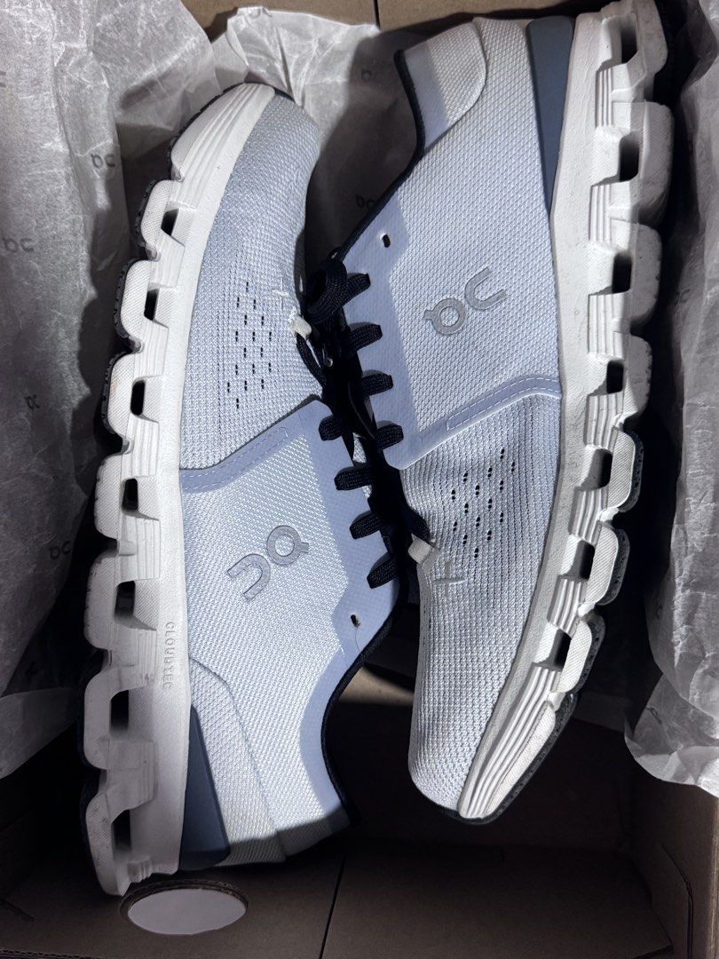 On Cloud X4 (Category: Sneakers) located in Balanga. Submitted by Rojenrhiray (Listing ID 1423477916, Image 3). Description: Bought this sa Capital Sm dasmariñas. 3times lang nagamit sa mall lang. With copy ng resibo. On Cloud X running shoes in white. Features black laces and a breathable upper. The box indicates a size 8.5 US Men's. The shoes have the "Cloud X" logo on the side and the insole. The sole has a unique cloud-like design. The shoes 