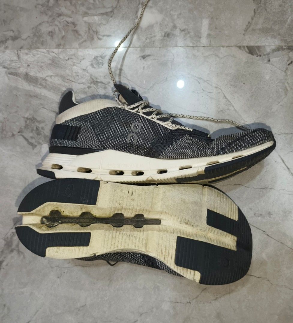 On CloudTec Running Shoes - (Category: Sneakers) located in Bayombong. Submitted by easyflip_04 (Listing ID 1423553521, Image 3). Description: On CloudTec running shoes. Features a black and white color scheme. The shoes have a mesh upper and a unique sole design. Size 47, US M12, UK 11.5. Made in Vietnam..