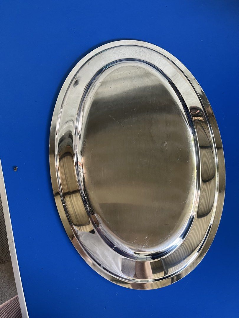 Oval Stainless Steel Serving Tray (Category: Other Kitchenware & Tableware) located in Calasiao. Submitted by maxwayne200413 (Listing ID 1423475020, Image 2). Description: - Stainless steel oval serving tray - Double-rimmed design - Dimensions: Approximately 18" x 12" - Great for serving appetizers, desserts, or drinks - Adds a touch of elegance.