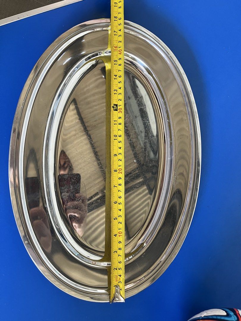 Oval Stainless Steel Serving Tray (Category: Other Kitchenware & Tableware) located in Calasiao. Submitted by maxwayne200413 (Listing ID 1423475020, Image 3). Description: - Stainless steel oval serving tray - Double-rimmed design - Dimensions: Approximately 18" x 12" - Great for serving appetizers, desserts, or drinks - Adds a touch of elegance.