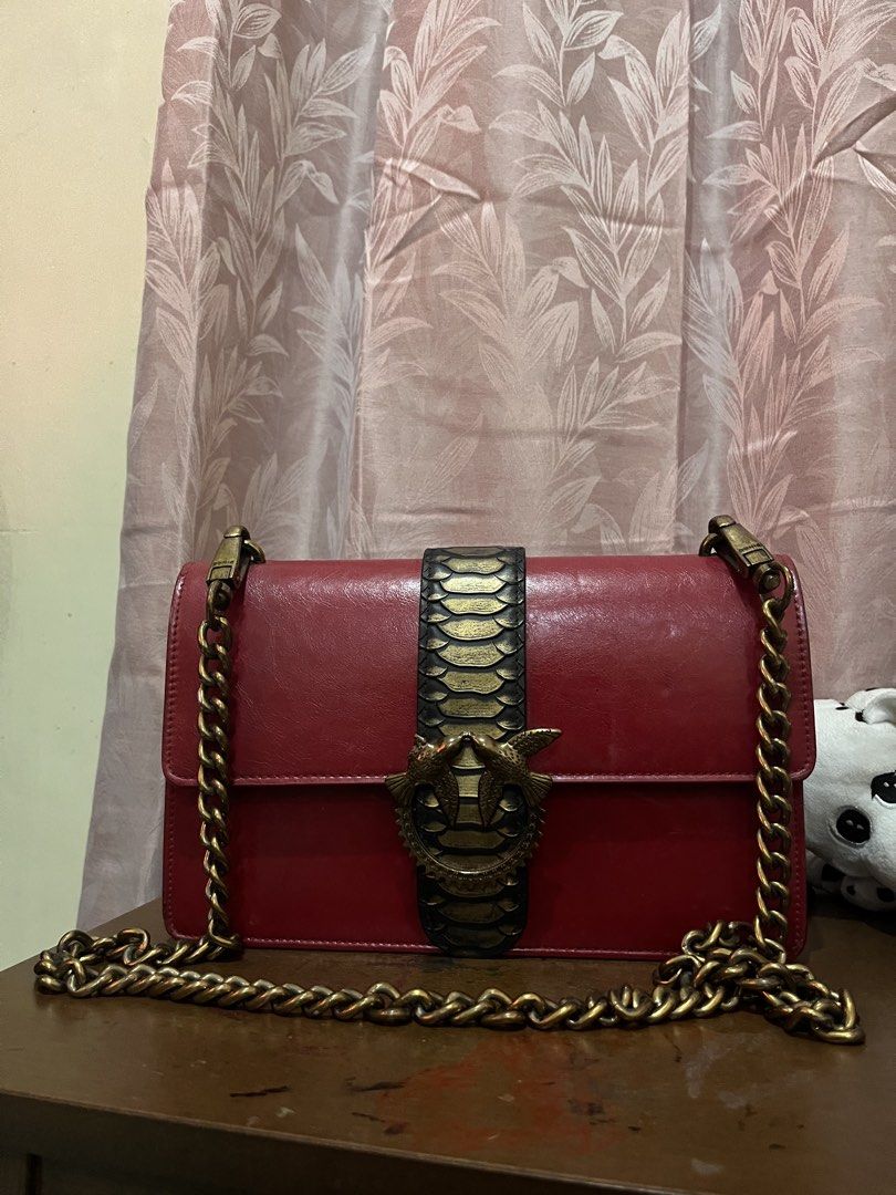 Pinko Love Bag (Category: Luxury Bags & Wallets) located in Las Pinas. Submitted by preloved_koto (Listing ID 1423557512, Image 3). Description: - Pinko Love Bag - Chain strap - Unique snake clasp design - Rectangular shape - Flap closure - Gold-colored chain - Made of leather.