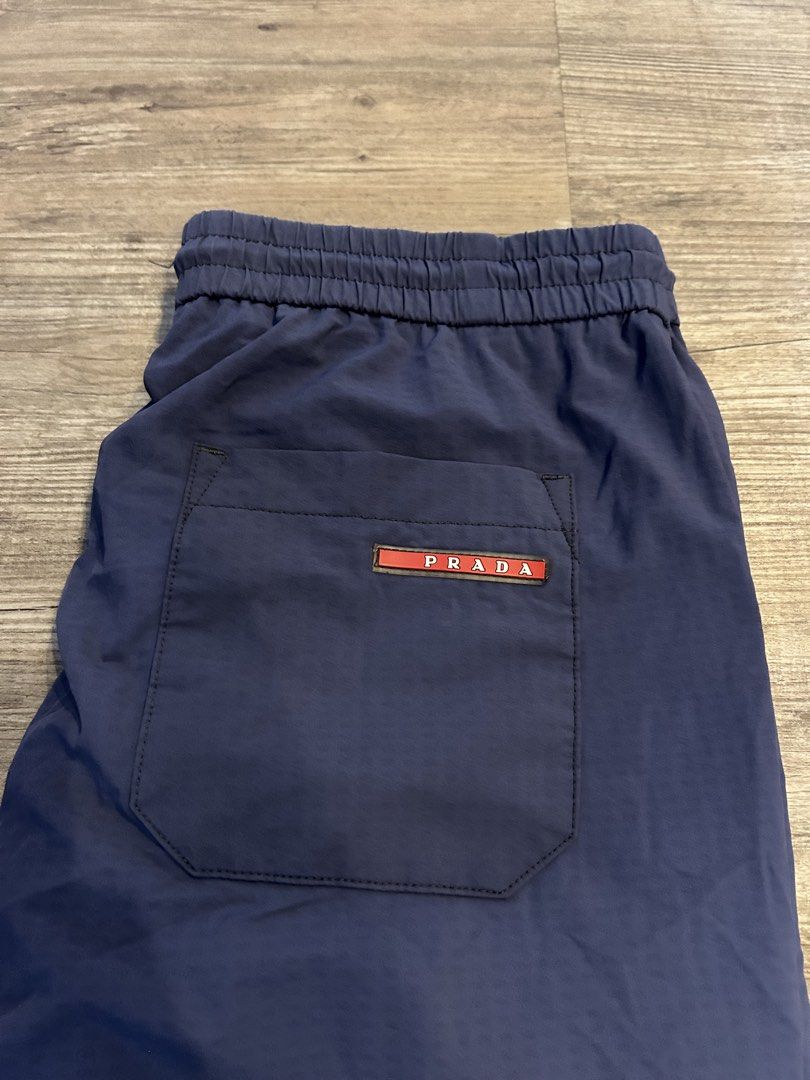 Prada - nylon track pants (Category: Joggers) located in Los Banos. Submitted by remynextdoor (Listing ID 1423447620, Image 2). Description: Waist: 33-38 Inseam: 26.5 in Thigh: 11 in Leg: 10 in Front Rise: 13 in NO MAIN TAG, FADED WASHTAG .
