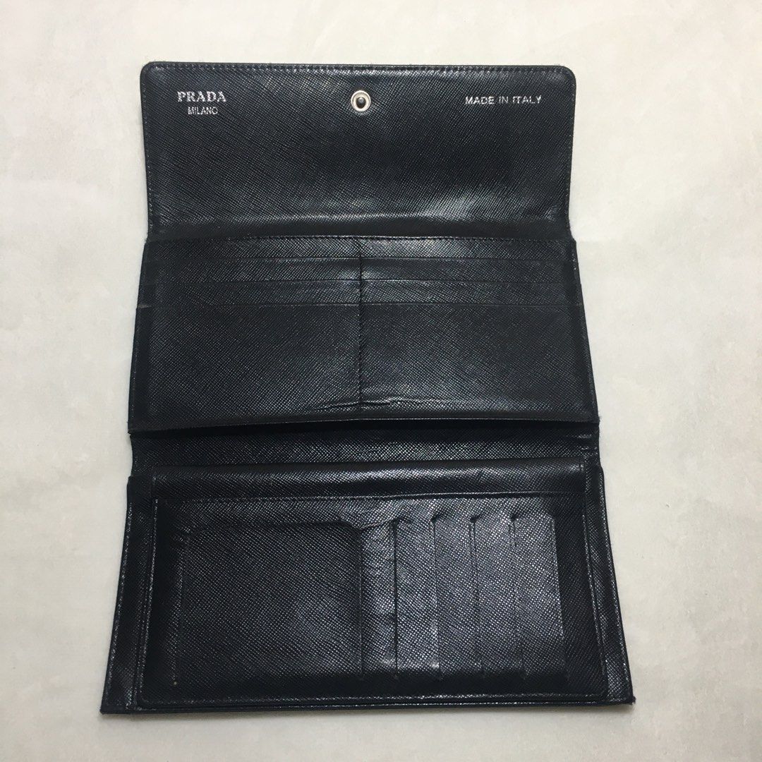 Prada Tri Fold Wallet (Category: Luxury Bags & Wallets) located in Paranaque City. Submitted by dresswell.ph (Listing ID 1423483994, Image 2). Description: Prada Tri Fold Wallet Excellent Condition Off Has multiple card slots and bill compartments Snap closure Issue: last pic.
