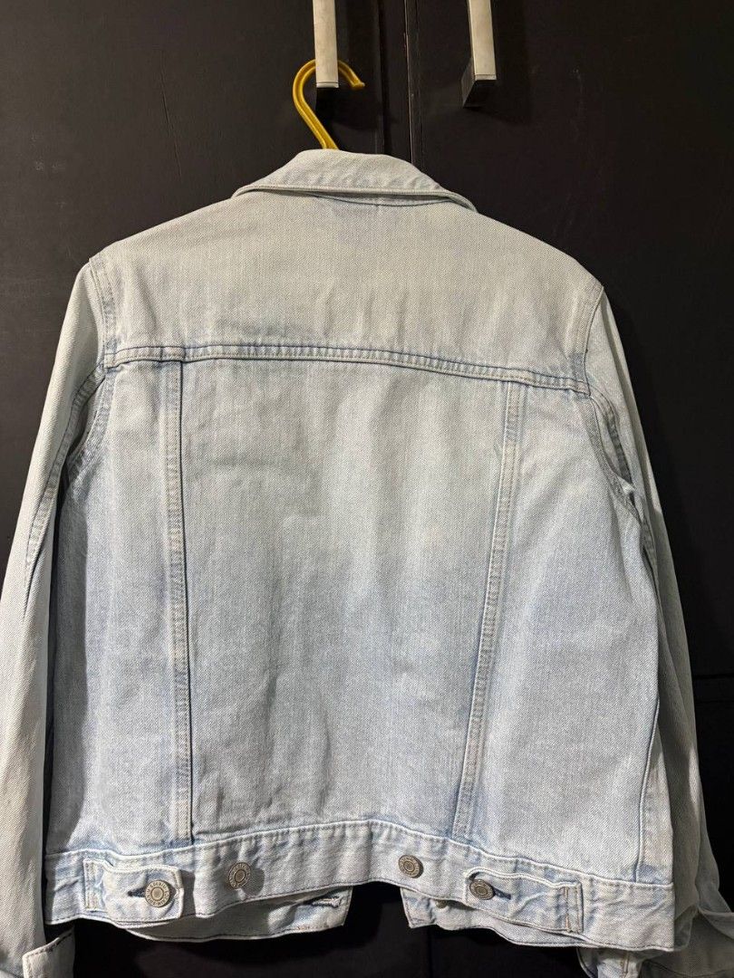 Pre-loved H&M Denim Jacket (Category: Coats, Jackets and Outerwear) located in Manila. Submitted by Rhidell (Listing ID 1423550193, Image 2). Description: Light blue denim jacket from H&M and a personal favorite. Features a classic design with button closures and pockets. The jacket is a size EUR 34, UK 6. Perfect for layering and adding a touch of casual style to any outfit..