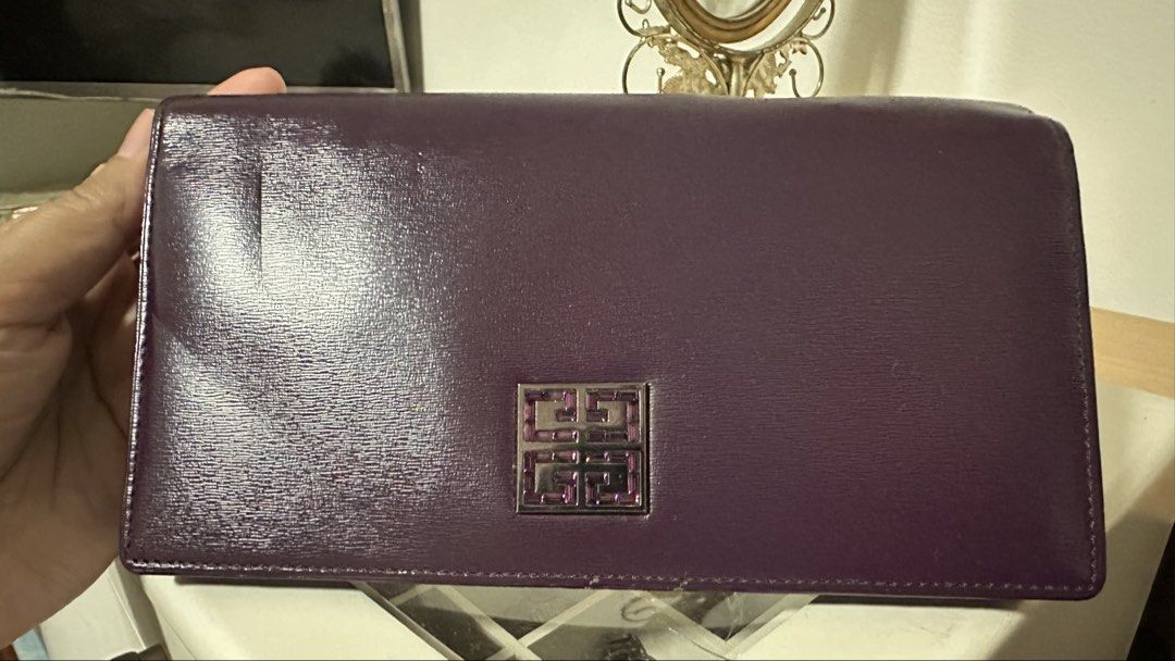 Purple Givenchy Long Wallet (Category: Luxury Bags & Wallets) located in Mandaluyong City. Submitted by TheWeekendProject (Listing ID 1423568711, Image 2). Description: - Givenchy long wallet - Purple leather - Features the iconic Givenchy logo - Stylish and functional design - Lots of compartment - Perfect for everyday use - Almost new. - Minor Dents visible due to handling..