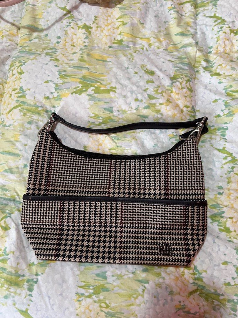 Ralph Lauren Shoulder Bag (Category: Luxury Bags & Wallets) located in Manila. Submitted by tjsells.101 (Listing ID 1423470483, Image 2). Description: Shoulder bag features a houndstooth pattern with a black leather trim and strap. The interior has a zippered pocket and a Lauren Ralph Lauren label. The bag has silver-tone hardware and a curved shape. The bag's exterior is a mix of black, beige, and burgundy. - Like new - rarely used - bought from