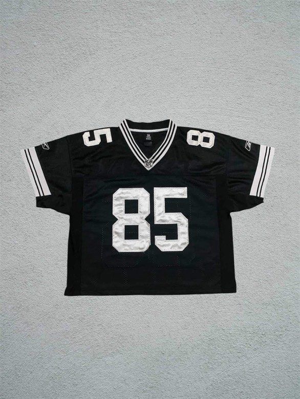 Reebok NFL Jersey - 85 Jennings (Category: Activewear) located in Mandaluyong City. Submitted by yesyesbuybuy (Listing ID 1423578982, Image 1). Description: Black Reebok NFL jersey. Features the number 85 on the front and back. The name "Jennings" is printed on the back above the number. Includes white stripes on the sleeves and collar. The jersey has a V-neck design. 23x25 Good for street wear fits! .
